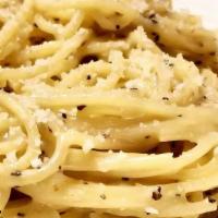Cacio E' Pepe · Spaghetti tossed with ground black pepper, butter, EVOO and fresh grated Pecorino cheese. Si...