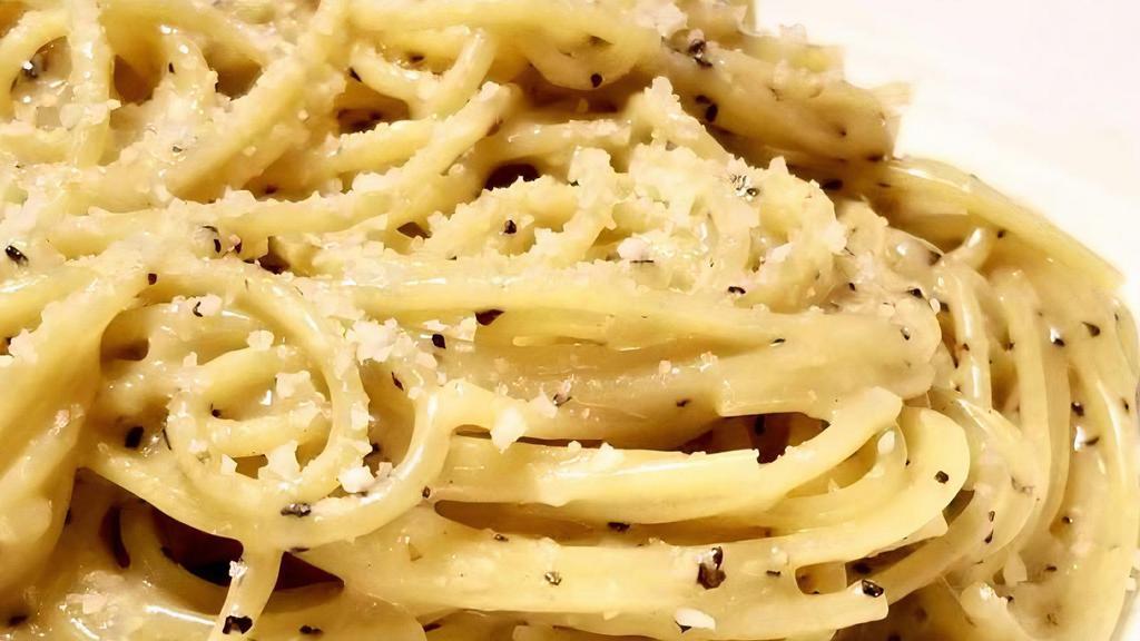 Cacio E' Pepe · Spaghetti tossed with ground black pepper, butter, EVOO and fresh grated Pecorino cheese. Simple, delicious.