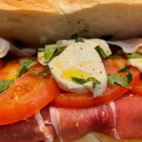 Prosciutto Caprese Sandwich · Imported prosciutto with buffalo mozzarella, extra virgin olive oil, tomato, and fresh basil.
