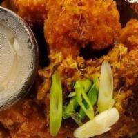 Crab And Corn Fritters · Light battered sweet corn fritters with a hint of jalepenos with a lemon cilantro dipping sa...