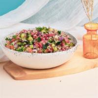 Tabbouleh · Chopped parsley, tomatoes, onions, lemon juice, cracked wheat, and olive oil.