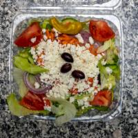 Greek Salad · Tomatoes cucumber onion and olives.
