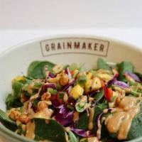 The Local · Grainmaker salad greens, cabbage slaw, mango salsa, scallions, Thai peanut spice, peanut lim...