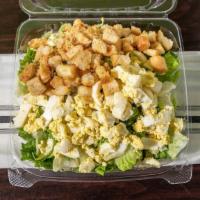 Caesar Salad · Tossed fresh iceberg and romaine lettuce, homemade baked croutons, and chopped hard boiled e...