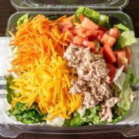 Tcs · Tossed fresh iceberg and romaine lettuce, grated carrots, flaked white tuna, Cheddar cheese,...