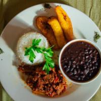 Pabellon Criollo · Shredded flank steak with white rice, black beans and sweet plantains.