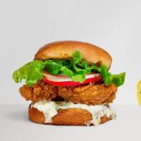 Classic Chicken Sandwich · Crispy fried chicken, lettuce, tomato, and mayo served on a golden hero roll.