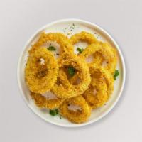 Crispy Rings · (Vegetarian) Sliced onions dipped in a light batter and fried until crispy and golden brown.
