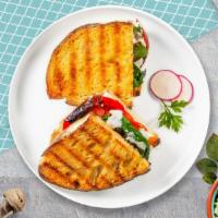 The Spinach Studio Panini · Baby spinach, fresh mozzarella, tomatoes, roasted red peppers served on a flat panini bread.