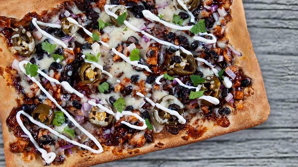 Bbq Chicken Flatbread · Grilled chicken, mozzarella, jalapenos, red onions, BBQ sauce and sour cream on the side.