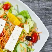 Greek Salad · Feta, Kalamata olives with pits and pepperoncini peppers over our tossed salad without mozza...
