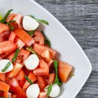 Caprese Salad · Fresh mozzarella, fresh ripe red tomatoes, fresh basil and our house balsamic vinaigrette on...