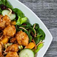 Asian Chicken Salad · Mixed greens, carrots, mandarin oranges, cucumbers, dried cranberries, chow mein noodles and...