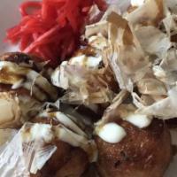 Takoyaki · Japanese style deep-fried octopus cakes with our house mayo and kagome sauce, garnished with...