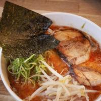 Spicy Paitan Ramen · Rayu, our original spicy sesame oil with slabs of char siu layered atop straight noodles wit...