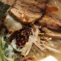 Miso Paitan Ramen · Pork infused miso served with wavy noodles, char siu, half of a seasoned soft-boiled egg, sc...