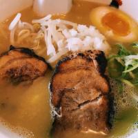 Curry Ramen · Golden curry in our broth with wavy noodles, char siu, half of a seasoned soft-boiled egg, s...