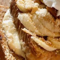 Banana Pudding French Toast · Layered Banana Pudding with fresh sliced bananas on top of pieces of French Toast