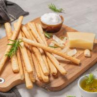 Bread Sticks · Homemade fresh baked bread sticks. Add cheese for an additional charge.