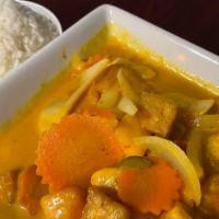Mango Curry · Fresh mango, onions, red-green pepper, carrot, and tomato in a yellow coconut milk curry. Se...