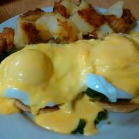 Eggs Florentine · Two dropped eggs on spinach on an English muffin with benedict sauce on top, served with hom...