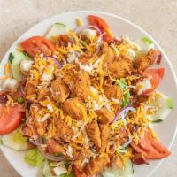 Western Chicken Salad · With romaine lettuce, tomatoes, cucumbers, onions, crispy chicken, bacon, croutons, shredded...