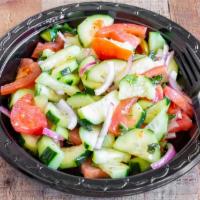 Cucumber Tomato Salad · Cucumbers, tomato wedges, red onions, and homemade Italian dressing.