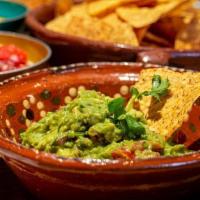 Chips & Guacamole (V) · Fresh tortilla chips served with ripe avocados blended with red onion, green chiles, tomatoe...