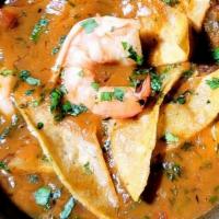 Mexican Seafood Soup · Gulf shrimp, fish and crabmeat in spicy shrimp and vegetable broth. Garinshed with corn tort...