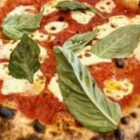 Margherita · San Marzano Tomato, House Made Mozzarella, Fresh
Basil
