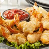Coconut Shrimp · Plump shrimp with a crunchy coconut and breadcrumb coated, deep fried to perfection.