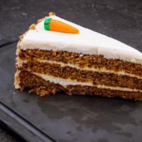 Carrot Cake · Contains nuts. Moist, perfectly spiced, double layered carrot cake with a rich, cream cheese...