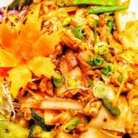 Pad Kee Mao · Wide rice noodles stir fried with tofu, vegetables, garlic, thai chili, basil.