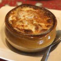 French Onion Soup · Topped with provolone cheese.
