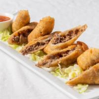 Cheese Steak Egg Roll · Wrapped with the original Philly steak, mozzarella cheese, onions, served with marinara dipp...