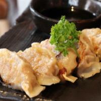 Gyoza · Pan-fried or steamed pork dumpling.