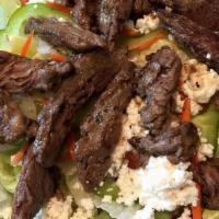 Steak Tip Garden Salad · A generous portion of fresh letters, tomatoes, carrots, cucumbers, red onions, and black oli...