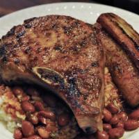 Pork Chop · Served with choice of Rice and Beans  or Fries.
