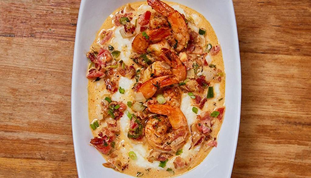 Shrimp And Grits · Shrimp, garlic, onion, pico de gallo and bacon served over pepper jack cheesy grits, topped with scallions.