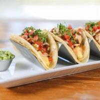 Breakfast Tacos · Three soft, corn tortilla, stuffed tacos served with pepper jack, scrambled eggs topped with...