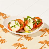 Caprese Salad · Sliced tomato, fresh mozzarella, and basil with olive oil.