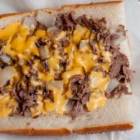 Cheese Steak · Pizza sauce, cheese steak meat, fried onions, and American cheese.