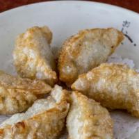 Mandoo · Handmade pork with chives dumplings or vegetable dumplings.