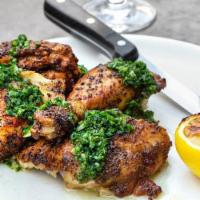Half Roasted Chicken · Half chicken roasted with ibérico lard, lemon, herbs and salsa Verde (serves two with the ad...