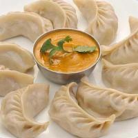 Chicken Momo  (Nepalese Appetizer) · Himalayan Style Steam Chicken dumpling. Served with spicy tomato chutney & sesame peanut chu...
