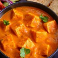 Paneer Tikka Masala · Cubes of cottage cheese cooked with creamy tomato sauce. Served with Basmati rice .