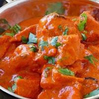 Chicken Tikka Masala · Dices boneless chicken cooked with creamy tomato sauce flavored with dry fenugreek & butter ...