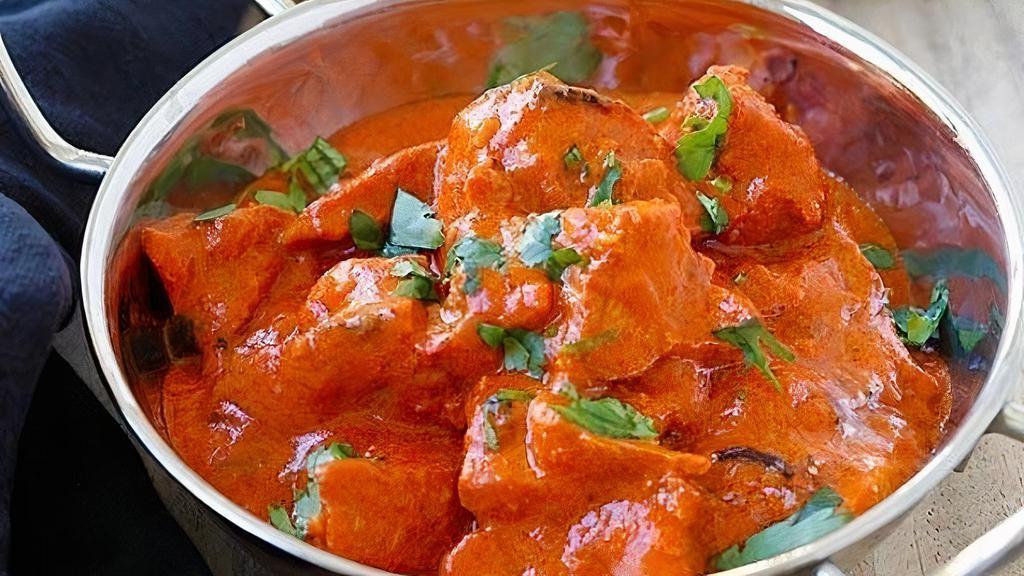 Chicken Tikka Masala · Dices boneless chicken cooked with creamy tomato sauce flavored with dry fenugreek & butter masala. Served with Basmati rice.