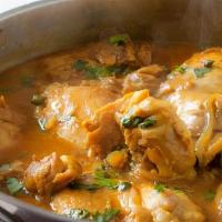 Chicken Curry · Traditional boneless  chicken curry prepared with tomato, onion sauce and ground spices. Ser...