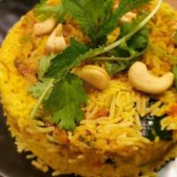 Chicken Biryani · Boneless chicken ,long-grained basmati rice flavored with exotic spices, saffron, biryani ma...